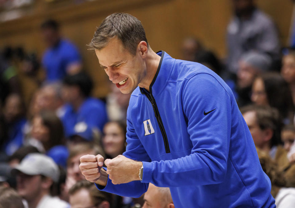 Duke head coach Jon Scheyer encourages his team during the first half of an NCAA college basketball game against Delaware in Durham, N.C., Friday, Nov. 18, 2022. (AP Photo/Ben McKeown)