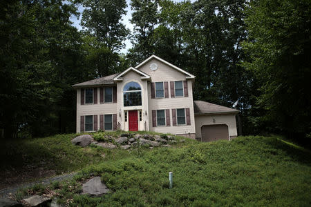 An unoccupied home is seen in the Penn Estates development where most of the homeowners are underwater on their mortgages in East Stroudsburg, Pennsylvania, U.S., June 20, 2018. REUTERS/Mike Segar