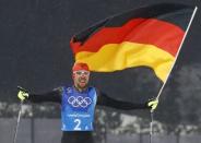 Nordic Combined Events - Pyeongchang 2018 Winter Olympics - Men's Team 4 x 5 km Final - Alpensia Cross-Country Skiing Centre - Pyeongchang, South Korea - February 22, 2018 - Johannes Rydzek of Germany celebrates with the German flag after winning REUTERS/Kai Pfaffenbach