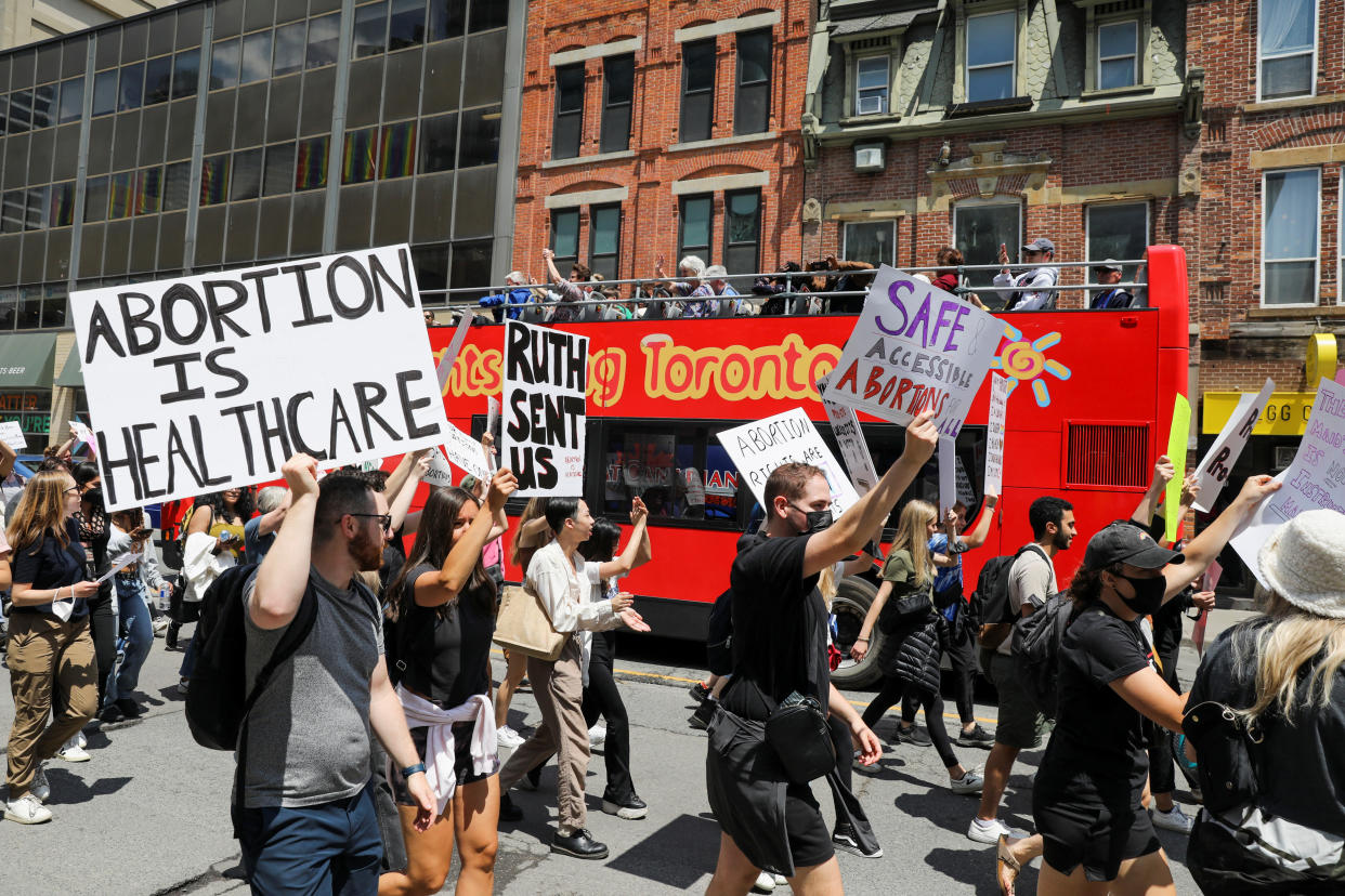 People march to the U.S. consulate in a protest after the U.S. Supreme Court ruled in the Dobbs v Women's Health Organization abortion case, overturning the landmark Roe v Wade abortion decision, in Toronto, Ontario, Canada June 29, 2022. REUTERS/Chris Helgren