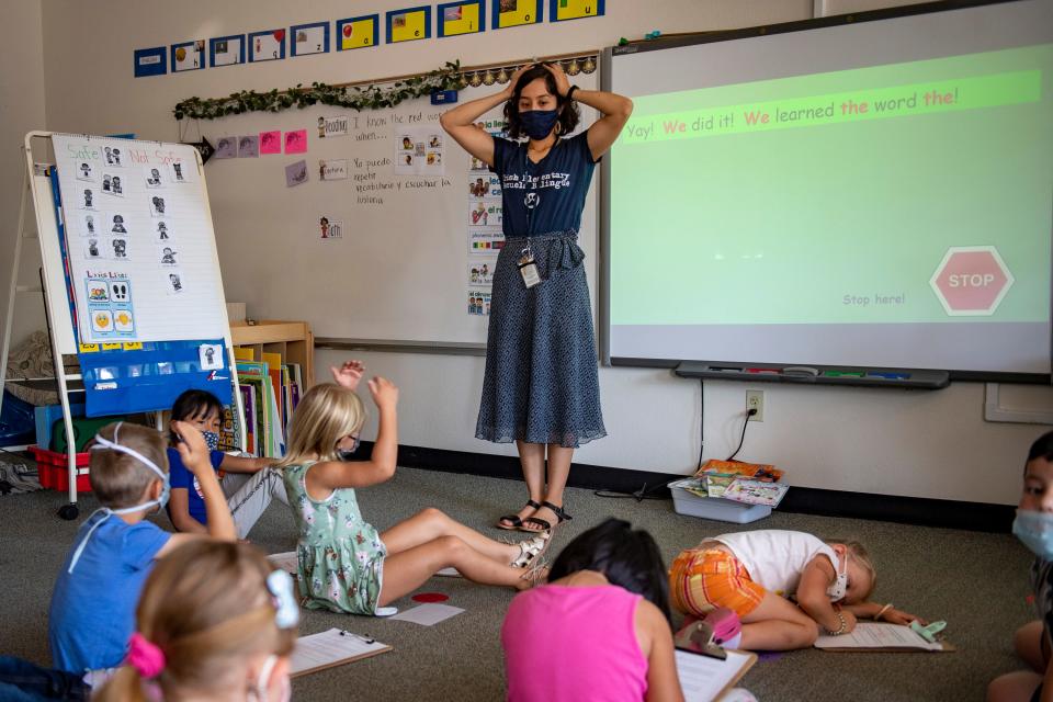 Kindergarten teacher Clari Hernandez works with her students Wednesday, Aug. 25, 2021, at her school, Irish Elementary Escuela Bilingüe, in Fort Collins.
