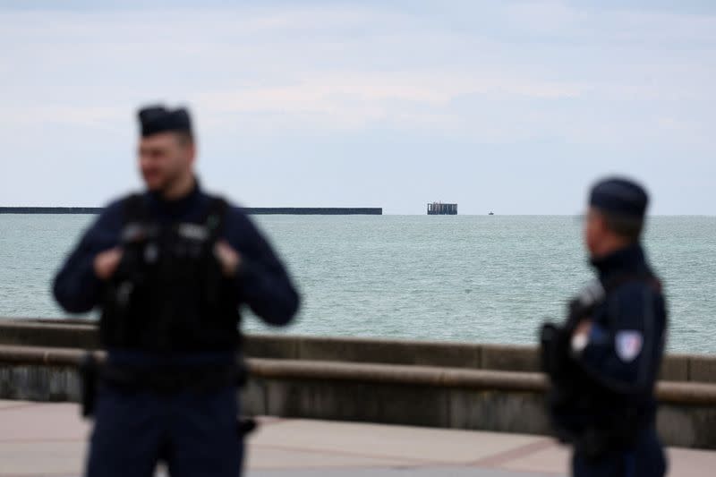 Security and rescue forces work on the beach of Wimereux, near Calais