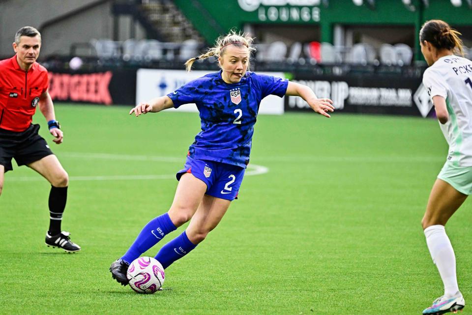 North Carolina senior and former Bolles midfielder Avery Patterson, pictured with the Under-23 U.S. women's national team in a preseason exhibition, dribbles the ball against Racing Louisville defender and St. Johns Country Day graduate Carson Pickett.