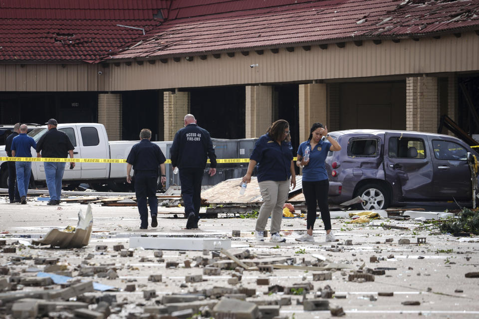 Authorities work at the scene where a tornado damaged several businesses Wednesday, April 10, 2024, in Katy, Texas. (Jon Shapley/Houston Chronicle via AP)