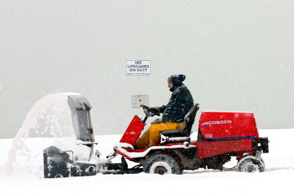 Sidewalk plow busy at work.