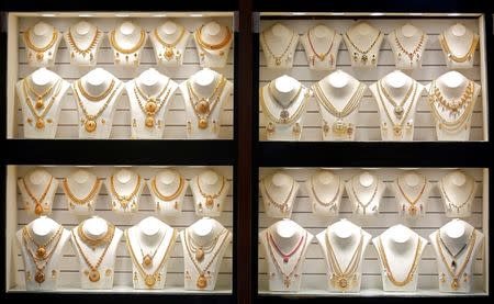 Gold necklaces are on display inside a jewellery showroom on the occasion of Akshaya Tritiya, a major gold buying festival, in Mumbai, April 18, 2018. REUTERS/Francis Mascarenhas/Files