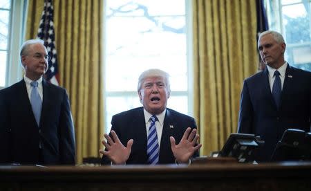 President Trump reacts to the AHCA health care bill being pulled by Congressional Republicans before a vote as he appears with Secretary of Health and Human Services Tom Price (L) and Vice President Mike Pence (R) in the Oval Office of the White House in Washington, U.S., March 24, 2017. REUTERS/Carlos Barria