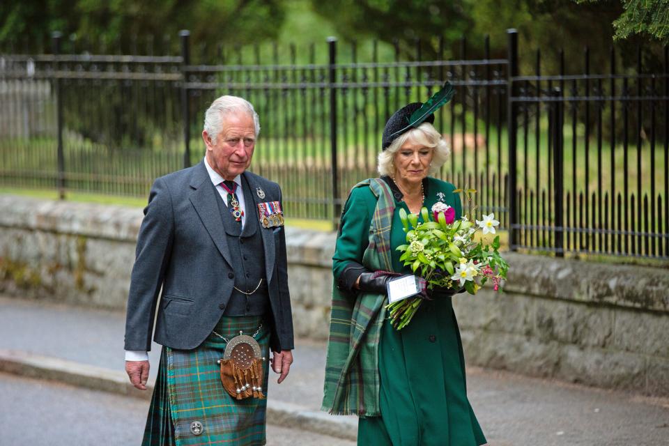 Prince Charles and his wife Camilla, Duchess of Cornwall, take part in a two-minute silence to mark the 75th anniversary of VE Day and laid flowers at the Balmoral War Memorial on May 8, 2020, near Crathie, Scotland.