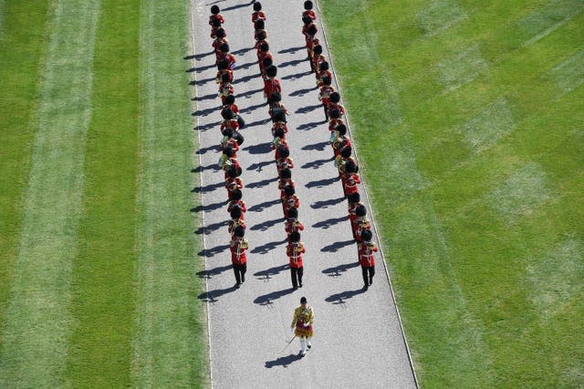 Members of the military arrive for the funeral