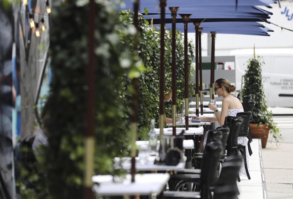 An outdoor dining area in New York City on July 30. Adults who tested positive for the coronavirus were roughly twice as likely to have dined at a restaurant within two weeks of having symptoms, a CDC study found. (Xinhua News Agency via Getty Images)