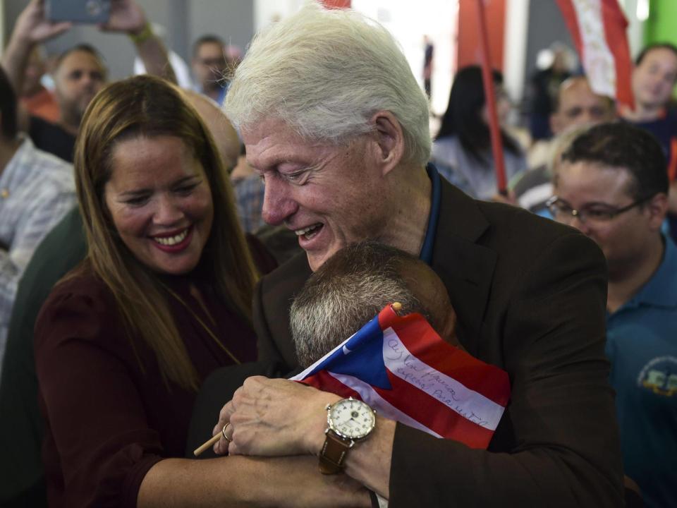 Hurricane Maria: Bill Clinton personally hands out supplies in Puerto Rico to survivors