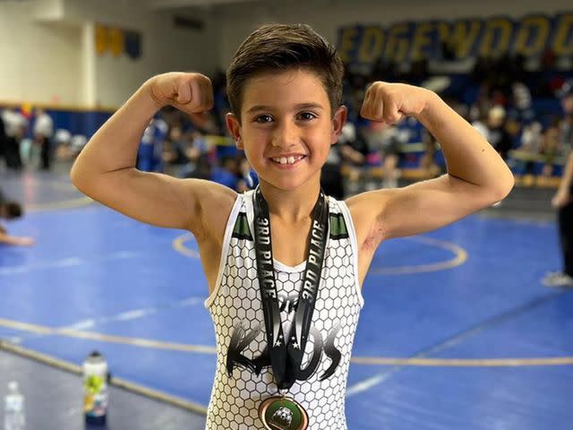 Mario Lopez Instagram Mario Lopez's son Dominic Lopez poses at a wrestling event.