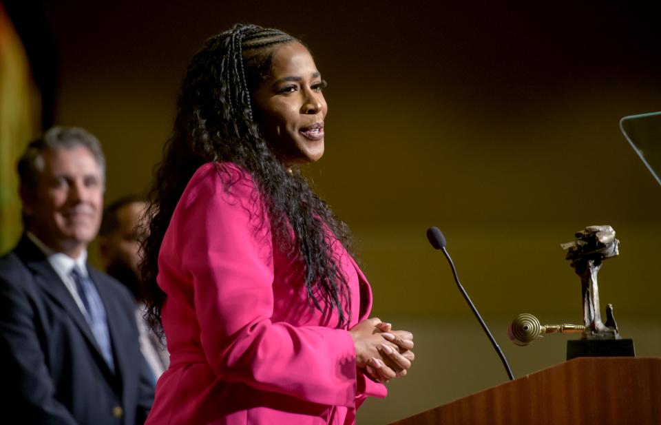 State Rep. Jehan Gordon-Booth accepts the Tom Connor Service Award for outstanding community service during the annual Peoria Area Chamber of Commerce Thanksgiving Luncheon on Thursday, Nov. 16, 2023 at the Peoria Civic Center.