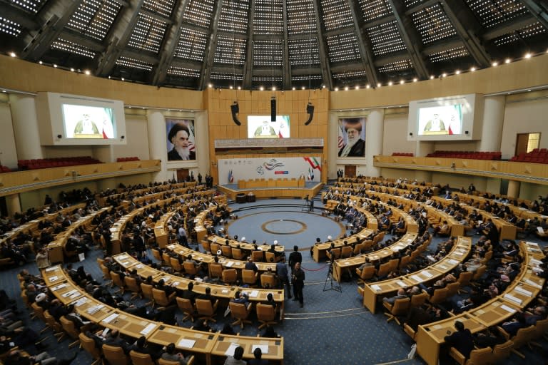 Charitable donors attend an annual ceremony in Tehran in which they pay off the debts of men jailed for failing to pay their mehrieh obligation after a divorce