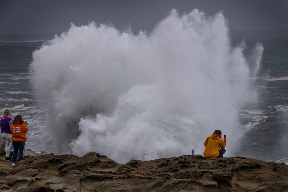 Spectators watch the Thanksgiving weekend King Tide event at Shore Acres States Park.