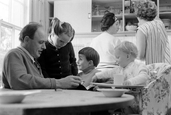 Roald Dahl reads to three of his children, from left, Tessa, Theo, and Ophelia, in the kitchen of his home in Great Missenden, Buckinghamshire, England in September 1965.<span class="copyright">Leonard McCombe—The LIFE Picture Collection/Getty Images</span>