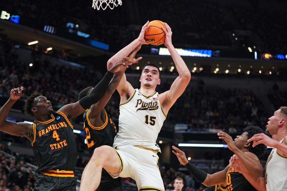 Purdue center Zach Edey (15) takes a shot at the basket as Grambling State forward Antwan Burnett (4) defends during the first half in the first round of the 2024 NCAA men's tournament at Gainbridge FieldHouse.