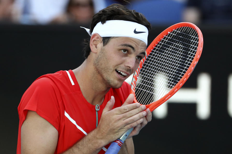 Taylor Fritz of the U.S. reacts after defeating Roberto Bautista Agut of Spain in their third round match at the Australian Open tennis championships in Melbourne, Australia, Saturday, Jan. 22, 2022. (AP Photo/Tertius Pickard)