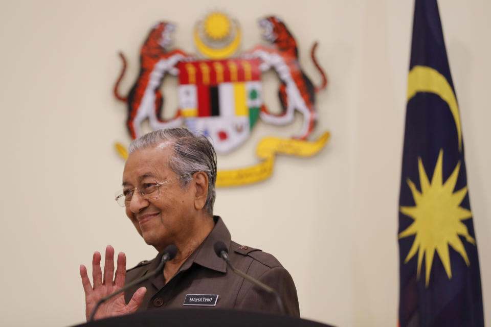 Malaysian Prime Minister Mahathir Mohamad gestures during a press conference in Putrajaya, Malaysia, Monday, April 15, 2019. Malaysia's government decided to resume a China-backed rail link project, after the Chinese contractor agreed to cut the construction cost by one-third. (AP Photo/Vincent Thian)