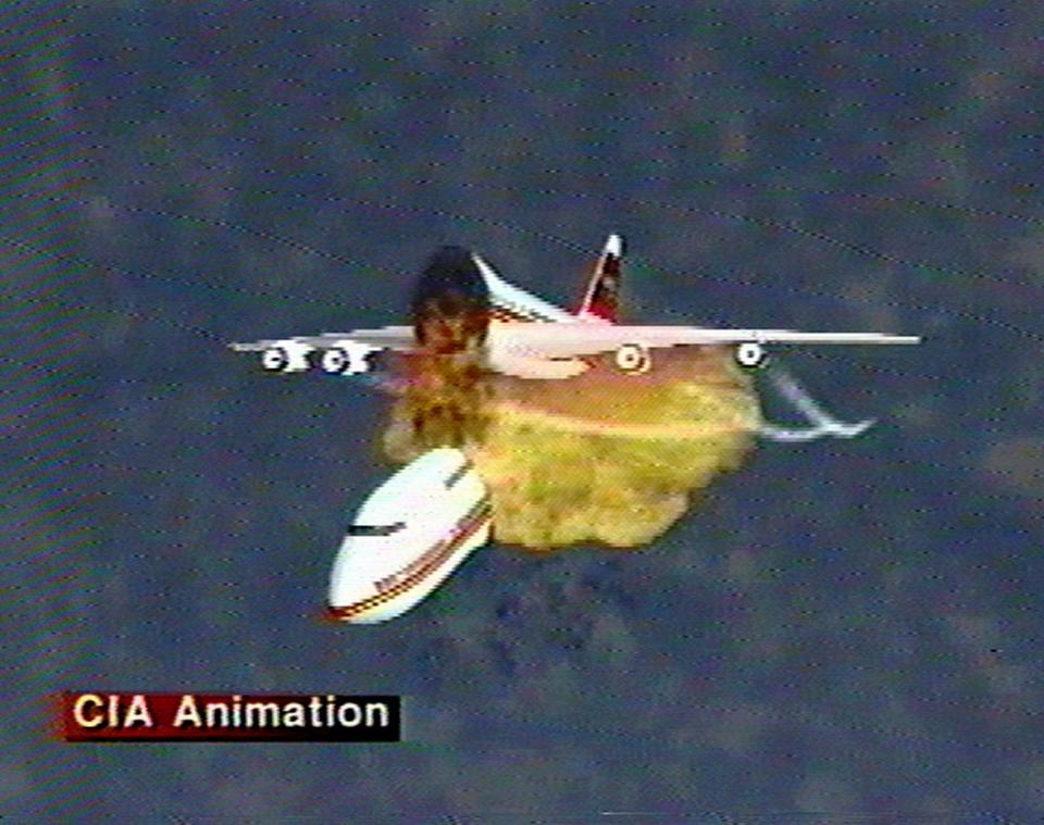 FILE - This file graphic image, provided by the Central Intelligence Agency, Dec. 9, 1997, shows an animation of the disintegration of Paris-bound TWA Flight 800 as it explodes off the coast of Long Island on July 17, 1996. The video was used to explain eyewitness accounts of the explosion, which killed all 230 people aboard. Former investigators on Wednesday, June 19, 2013 called on the National Transportation Safety Board to re-examine the cause, saying new evidence points to the often-discounted theory that a missile strike may have downed the jumbo jet. (AP Photo/Central Intelligence Agency, File)