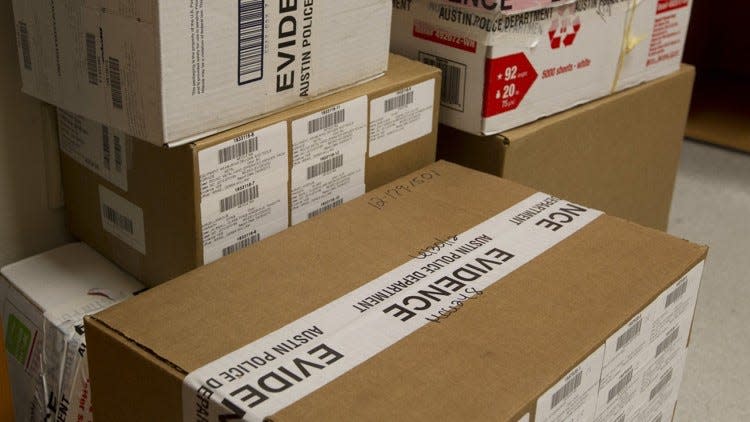 Boxes are stacked on the floor of the chemistry vault cabinet at the Austin Police Department’s Forensic Science Laboratory in 2013.