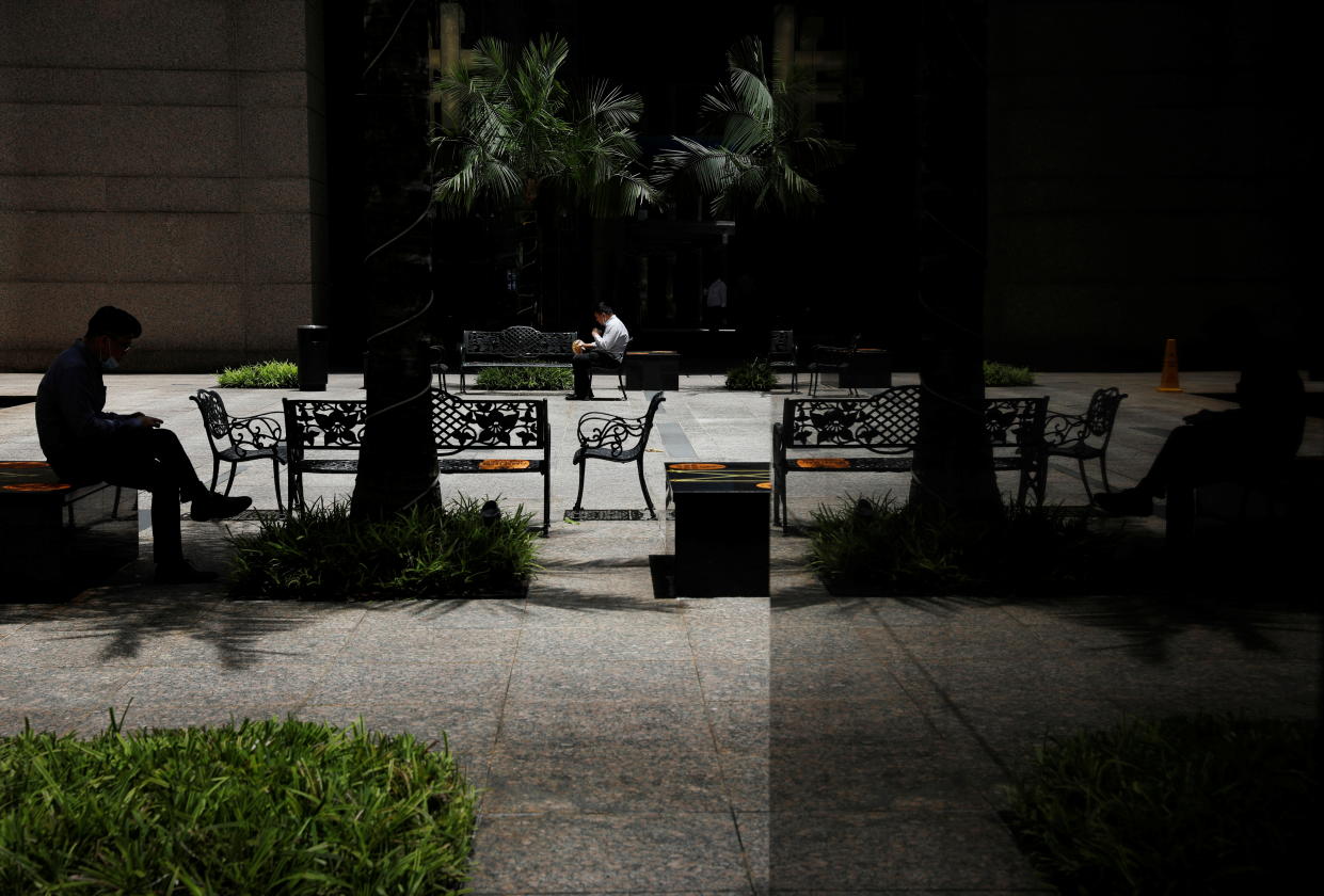 Office workers spend their lunch breaks at the central business district during the coronavirus disease (COVID-19) outbreak in Singapore, September 8, 2021. REUTERS/Edgar Su