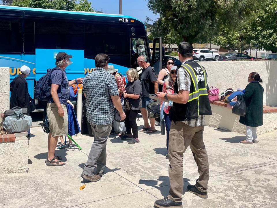 The first busloads of passengers from a derailed Amtrak train arrive at Moorpark's Active Adult Center Wednesday afternoon, where they could be reunited with family on June 28, 2023.