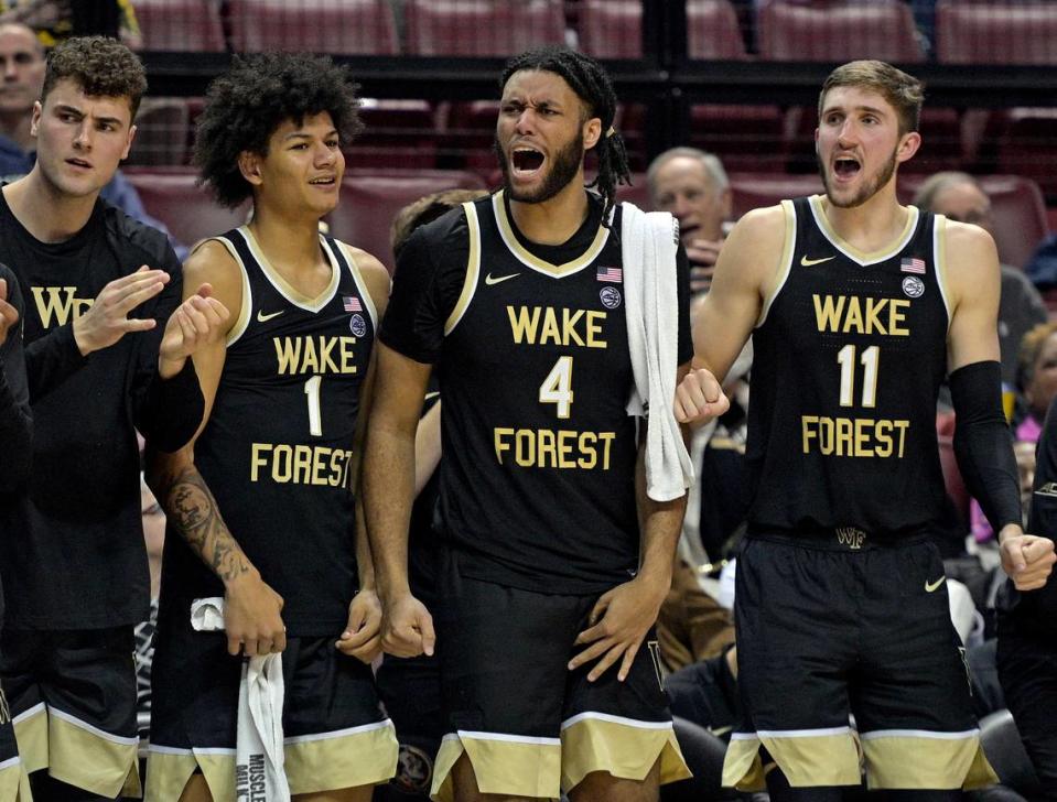 Jan 9, 2024; Tallahassee, Florida, USA; Wake Forest Demon Deacons forwards Marqus Marion (1), Efton Reid III (4), and Andrew Carr (11) react during the second half against the Florida State Seminoles at Donald L. Tucker Center.