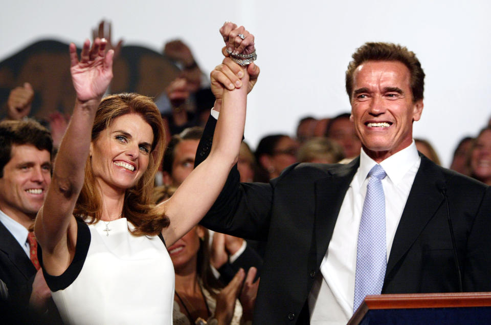 LOS ANGELES - OCTOBER 7:  Newly elected California Governor Arnold Schwarzenegger and wife, Maria Shriver, wave to the supporters on stage following his victory in the California Recall Election at the Century Plaza Hotel October 7, 2003 in Los Angeles, California.  Gov. Gray Davis lost by a wide margin in the recall, while Schwarzenegger won handily over his nearest Democratic opponent, Lt. Gov. Cruz Bustamante .  (Photo by Mario Tama/Getty Images)