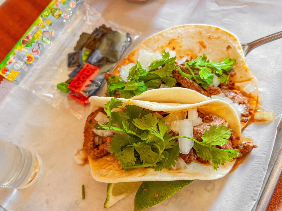 Taco Boy in West Asheville now offers an "Adult Happy Meal" that is served with two tacos, a beer, a tequila shot and a surprise