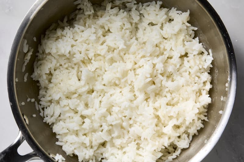 A pot of cooked white jasmine rice.