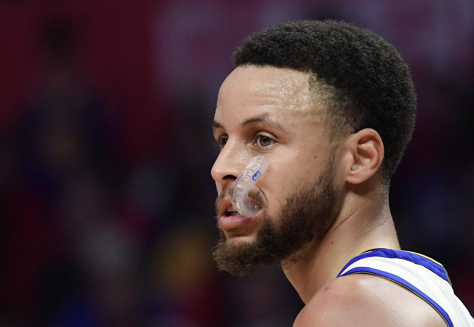 Golden State Warriors guard Stephen Curry stands on the court during the second half in Game 4 of a first-round NBA basketball playoff series against the Los Angeles Clippers Sunday, April 21, 2019, in Los Angeles. The Warriors won 113-105. (AP Photo/Mark J. Terrill)