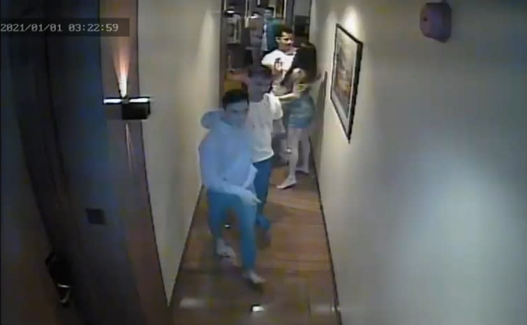 Christine Angelica Dacera, 23, is seen in a hallway at City Garden Hotel in Makati, Philippines, with some men.