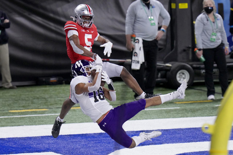 FILE - In this Dec. 19, 2020, file photo, Northwestern defensive back Brandon Joseph (16) intercepts a pass intended for Ohio State wide receiver Garrett Wilson (5) in the end zone during the first half of the Big Ten championship NCAA college football game in Indianapolis. Joseph was selected to The Associated Press Preseason All-America first team defense, Monday Aug. 23, 2021.(AP Photo/AJ Mast, File)