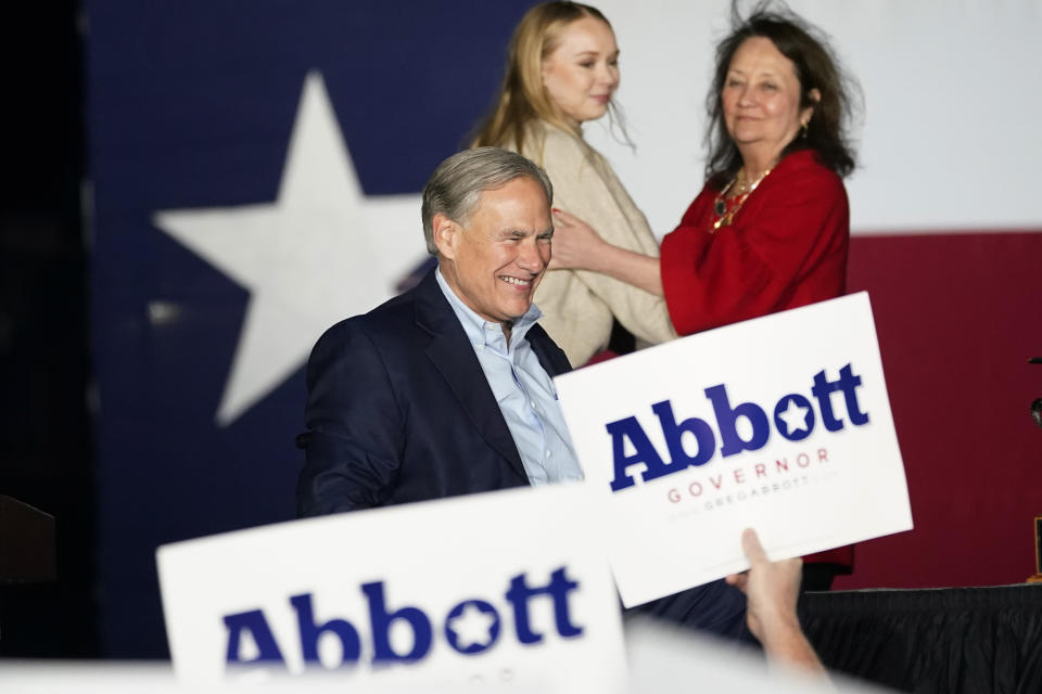 Texas Gov. Greg Abbott, with his wife Cecilia and daughter Audrey, attends a primary election night event, Tuesday, March 1, 2022, in Corpus Christi, Texas. (AP Photo/Eric Gay)