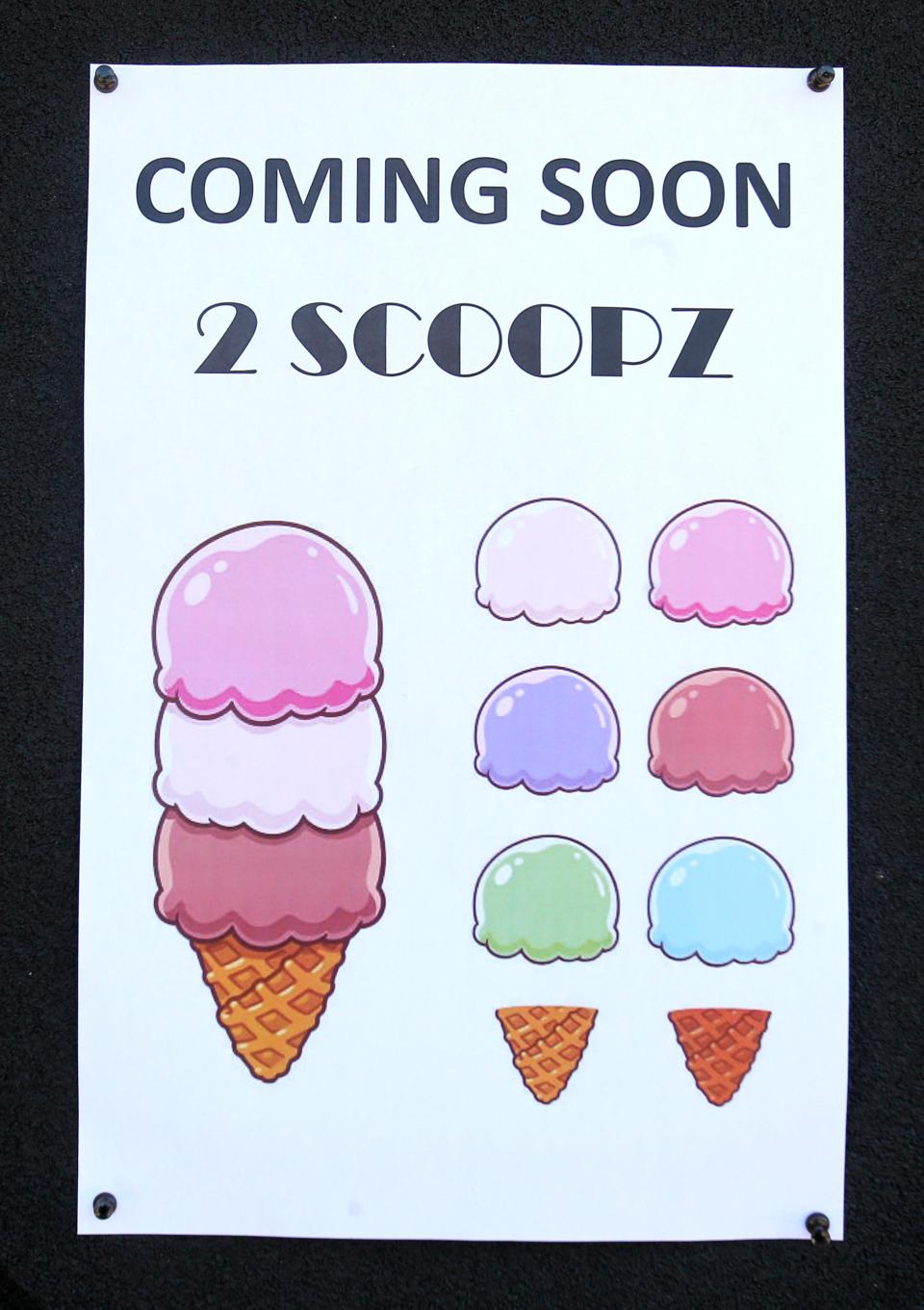 A sign hangs on the future home of 2 Scoopz Ice Cream Shop in Canton.