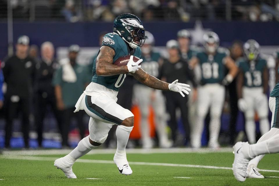 Philadelphia Eagles' D'Andre Swift runs with the ball against the Dallas Cowboys during the first half of an NFL football game, Sunday, Dec. 10, 2023, in Arlington, Texas. (AP Photo/Sam Hodde)