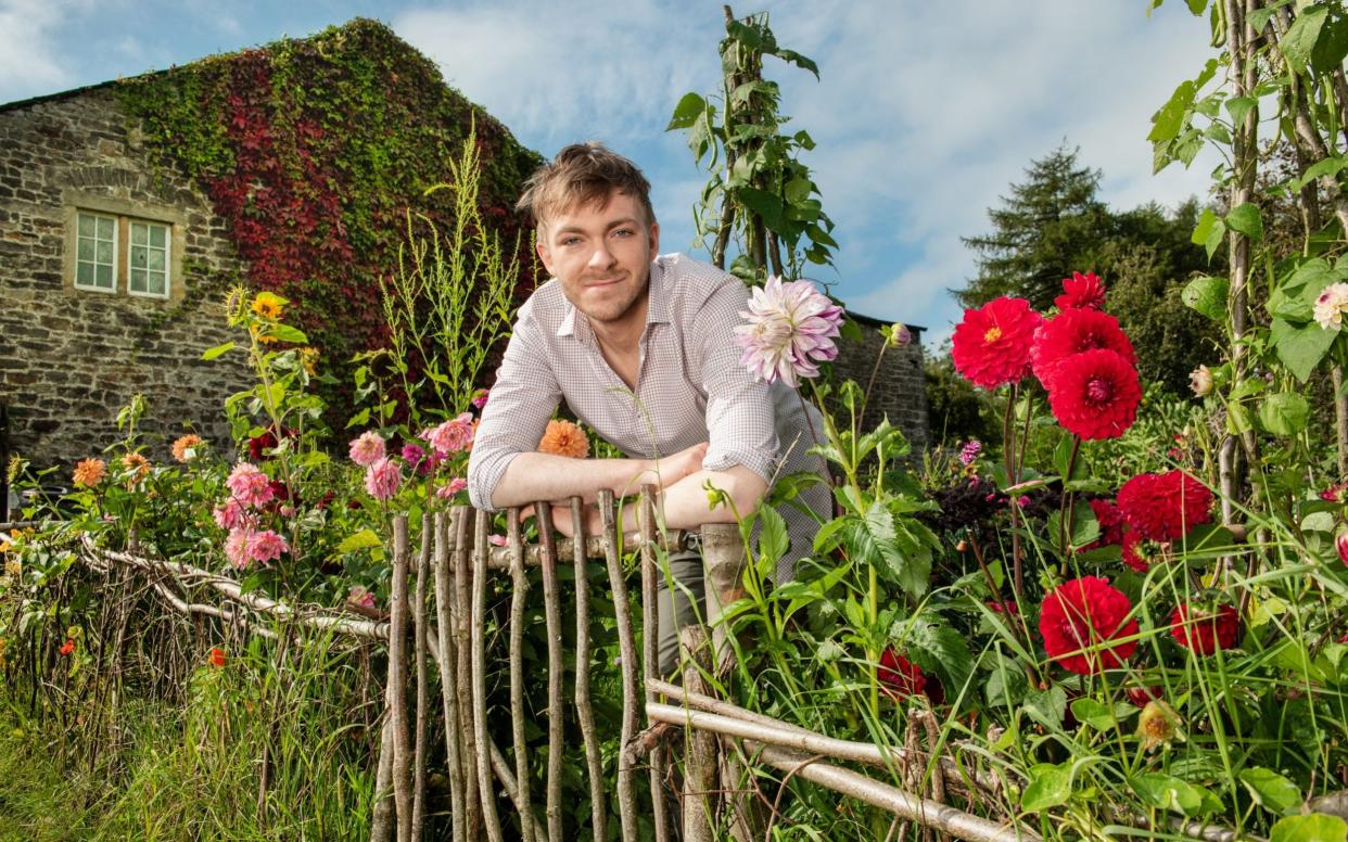 Robin Lucas in his garden in Lancashire, pictured, which he built from scratch during lockdown - Paul Cooper 