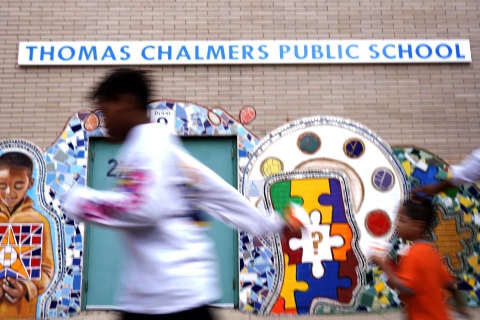Thomas Chalmers Public School sign is seen outside of school in Chicago, Wednesday, July 13, 2022. America's big cities are seeing their schools shrink, with more and more of their schools serving small numbers of students. Those small schools are expensive to run and often still can't offer everything students need (now more than ever), like nurses and music programs. Chicago and New York City are among the places that have spent COVID relief money to keep schools open, prioritizing stability for students and families. But that has come with tradeoffs. And as federal funds dry up and enrollment falls, it may not be enough to prevent districts from closing schools. (AP Photo/Nam Y. Huh)