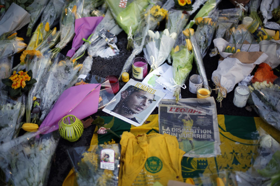 Flowers in homage to player Emiliano Sala are pictured outside La Beaujoire stadium before the French soccer league match Nantes against Saint Etienne, in Nantes, western France, Wednesday, Jan.30, 2019. Argentine soccer player Emiliano Sala disappeared over the English Channel on Jan. 21, 2019 as it flew from France to Wales. Sala had just been signed by Premier League club Cardiff. (AP Photo/Thibault Camus)