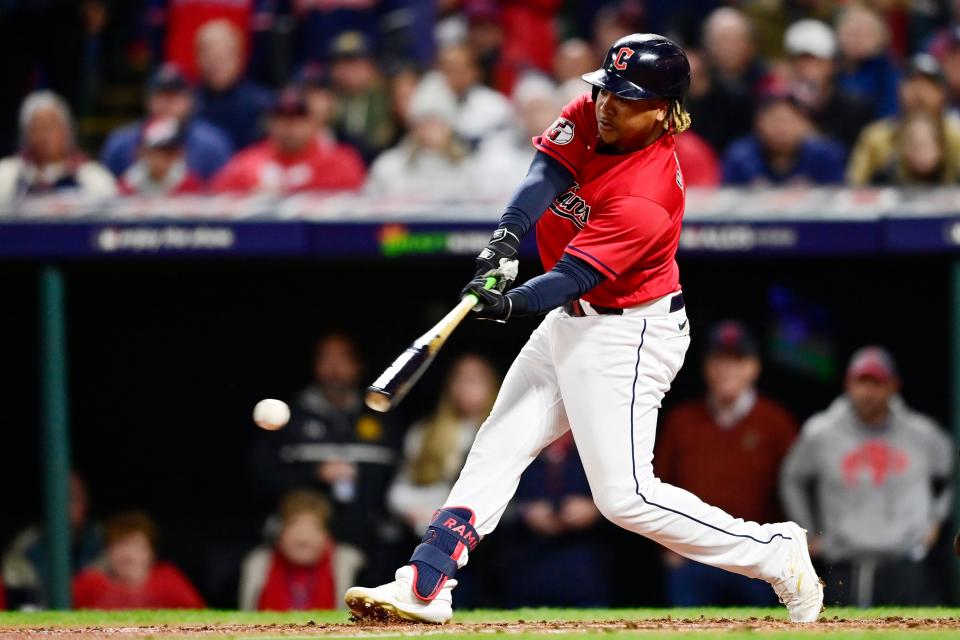 Cleveland Guardians' Jose Ramirez hits an RBI-single in the third inning of Game 4 of a baseball AL Division Series against the New York Yankees, Sunday, Oct. 16, 2022, in Cleveland. (AP Photo/David Dermer)