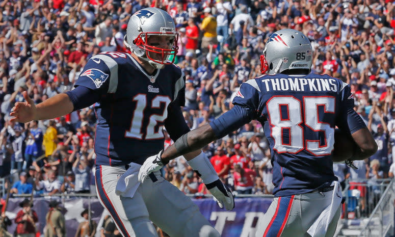 New England Patriots QB Tom Brady high fives wide receiver Kenbrell Thompkins.