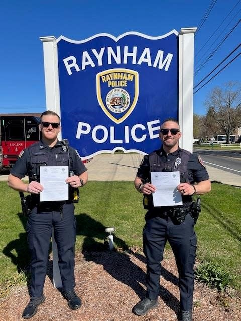 Raynham Police Officers Patrick Leahy and Joshua O'Brien with commendations awarded by Raynham Police Chief David LaPlante.