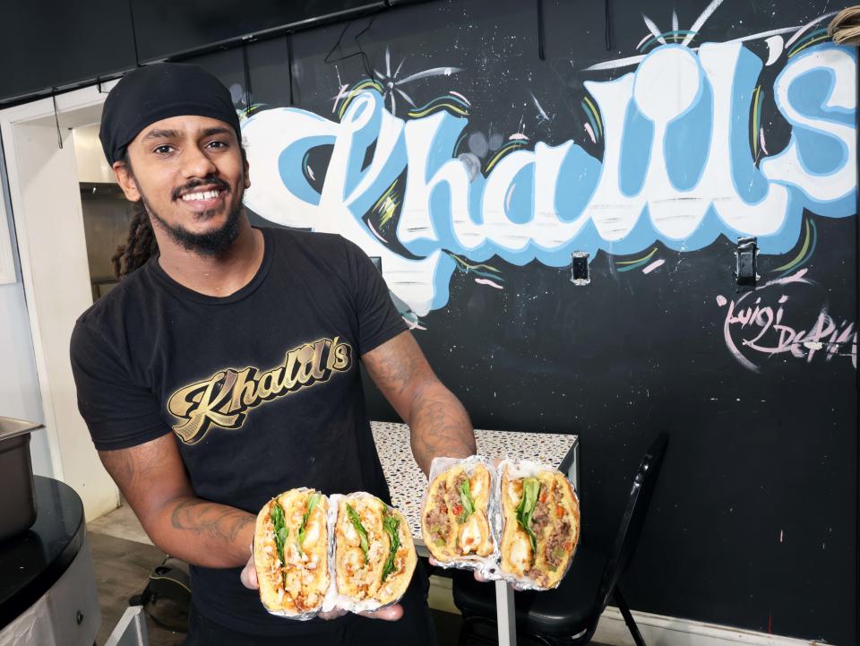 Rudy Alves, owner of Khalil's Kitchen, at 880 Main St. in Brockton, shows off some sandwiches on Tuesday, October 24,2023.