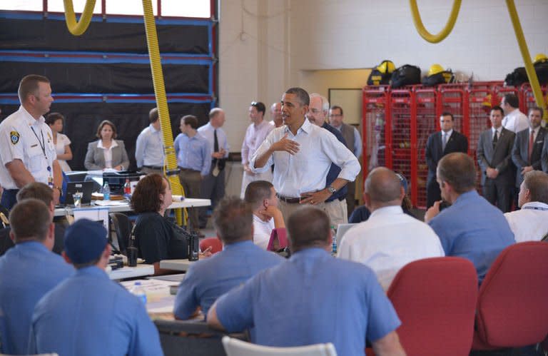 US President Barack Obama greets firefighters during a visit to Moore Fire Department Station No. 1 in Moore, Oklahoma, on May 26, 2013