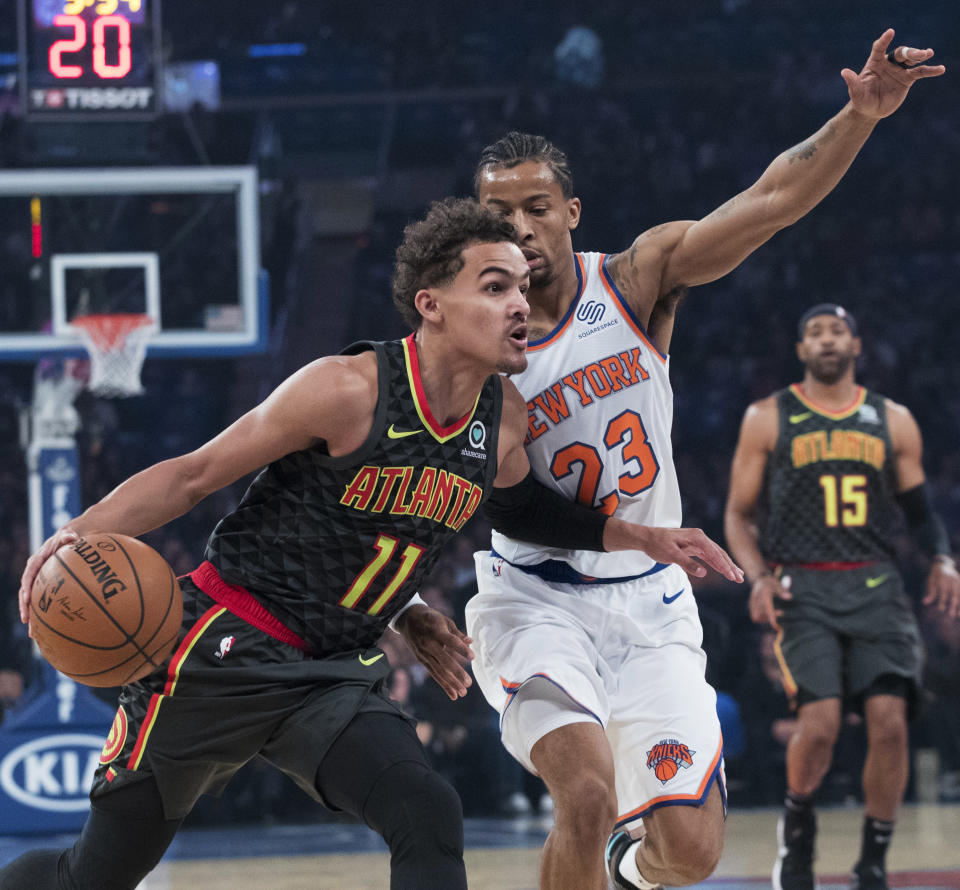 Atlanta Hawks guard Trae Young (11) drives to the basket against New York Knicks guard Trey Burke (23) during the first half of an NBA basketball game, Wednesday, Oct. 17, 2018, at Madison Square Garden in New York. (AP Photo/Mary Altaffer)