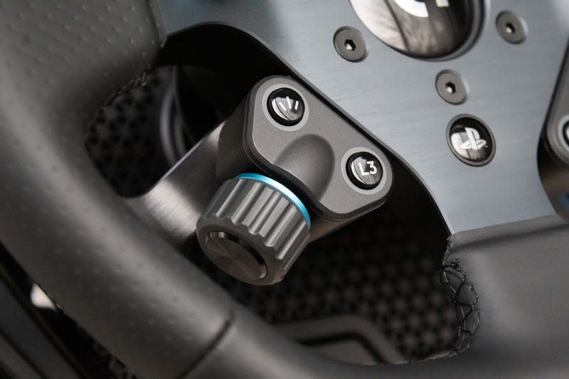 Close up on "thumb sweep" dial on left side of Logitech G Pro steering wheel.