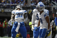 Detroit Lions running back Jamaal Williams (30) celebrates with teammates after scoring on a 2-yard touchdown run during the first half of an NFL football game against the Minnesota Vikings, Sunday, Sept. 25, 2022, in Minneapolis. (AP Photo/Craig Lassig)