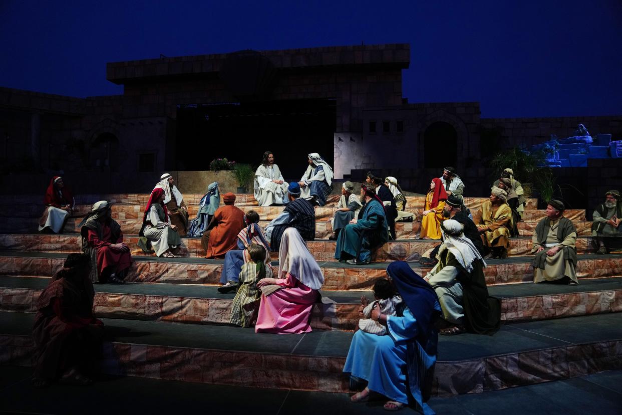 Jesus Christ, played by Jef Rawls (top left), performs with the rest of the cast during a dress rehearsal for the Easter pageant at the Mesa Arizona Temple on March 31, 2022.
