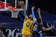 Golden State Warriors guard Mychal Mulder (15) goes up for a dunk in front of Oklahoma City Thunder center Isaiah Roby (22) and center Moses Brown (9) in the first half of an NBA basketball game Wednesday, April 14, 2021, in Oklahoma City. (AP Photo/Sue Ogrocki)